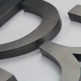 Brushed Stainless Steel Channel Letters – Dark or Black Oxidized Finish, Modern Industrial & Vintage Metal Effect Signage