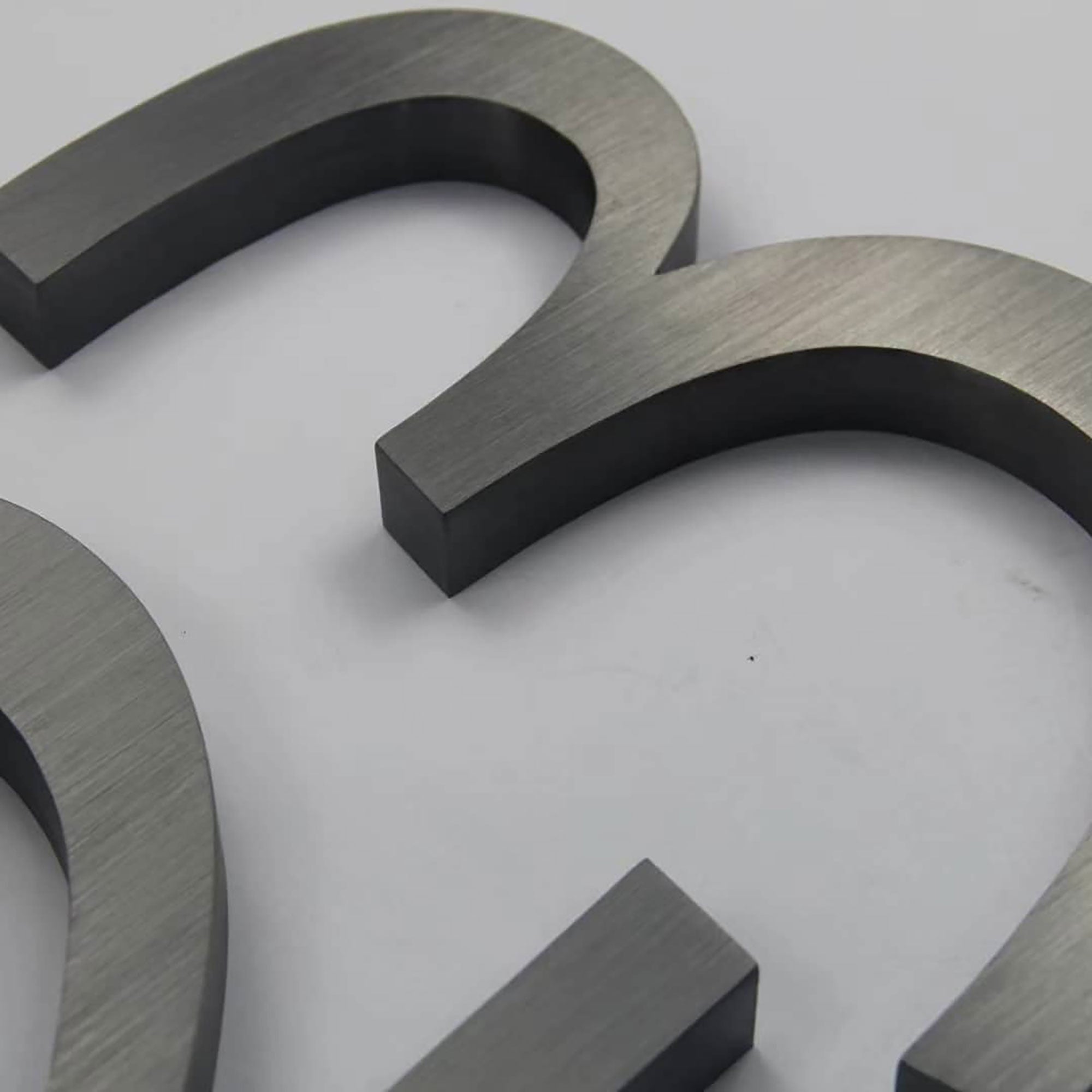 Brushed Stainless Steel Channel Letters – Dark or Black Oxidized Finish, Modern Industrial & Vintage Metal Effect Signage