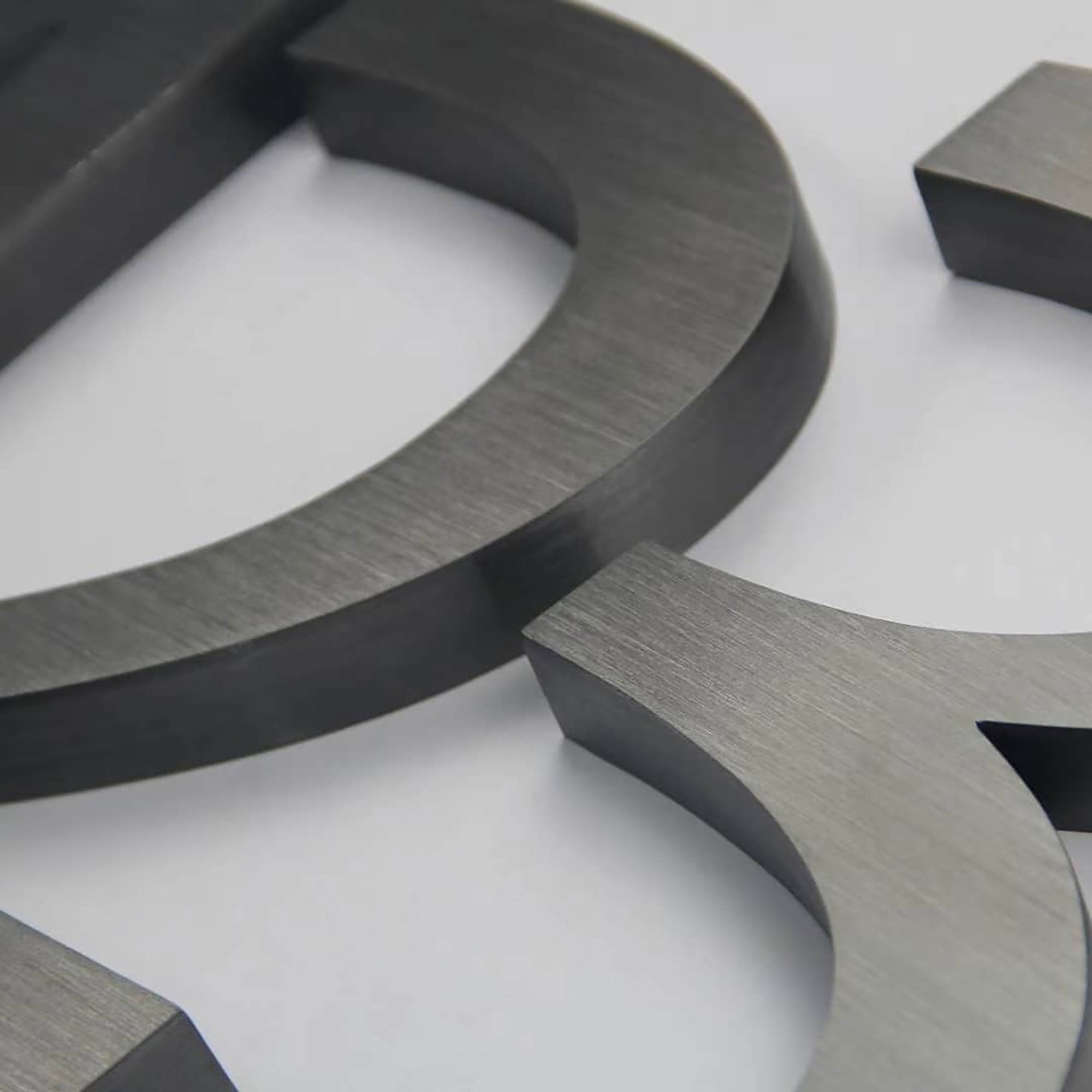 Brushed Stainless Steel Channel Letters – Dark or Black Oxidized Finish, Modern Industrial & Vintage Metal Effect Signage